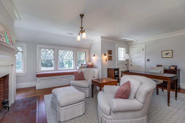 living room with crown molding, a healthy amount of sunlight, and hardwood / wood-style floors