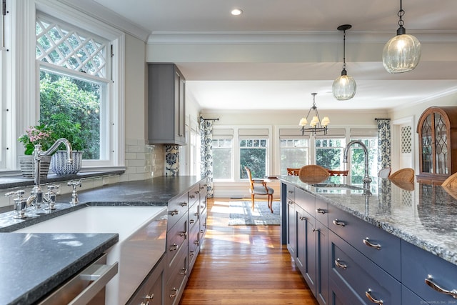 51 Ferry Bridge Rd, Washington, CT 06793 - kitchen featuring ornamental molding, dishwasher, hanging light fixtures, decorative backsplash, and wood finished floors