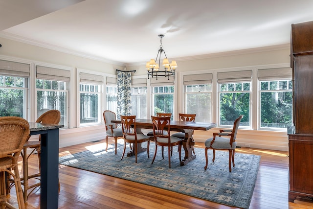 51 Ferry Bridge Rd, Washington, CT 06793 - dining space featuring healthy amount of natural light, a chandelier, crown molding, and hardwood / wood-style flooring