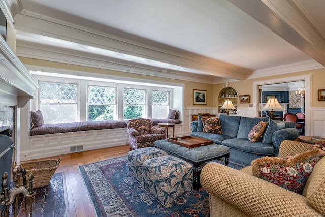 51 Ferry Bridge Rd, Washington, CT 06793 - living room with beamed ceiling, a decorative wall, crown molding, and wood finished floors