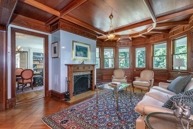 living room with coffered ceiling, beamed ceiling, parquet flooring, an inviting chandelier, and wood ceiling