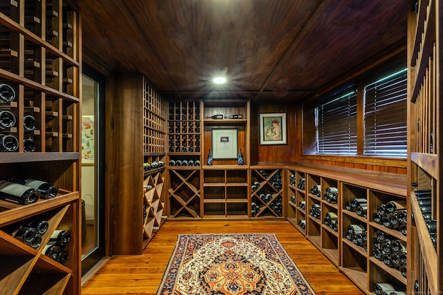 wine cellar featuring wooden ceiling and light hardwood / wood-style flooring