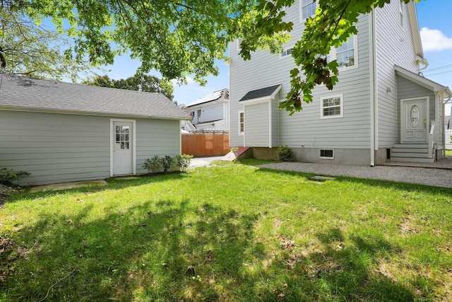 view of yard with entry steps and fence