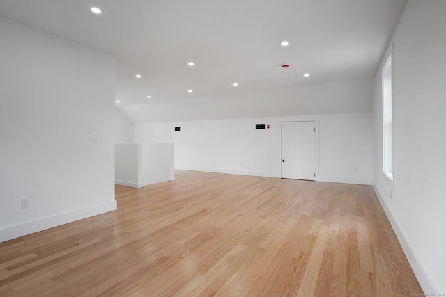 bonus room featuring baseboards, recessed lighting, and light wood-style floors