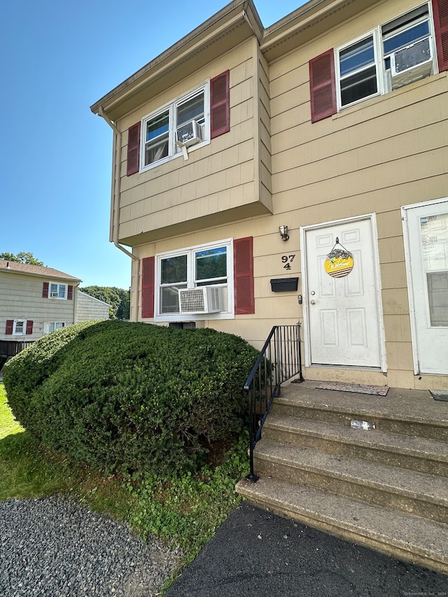 view of front of house featuring cooling unit