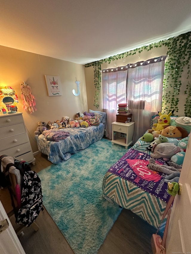 bedroom with wood-type flooring