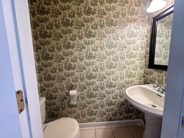 bathroom with tile patterned floors and toilet