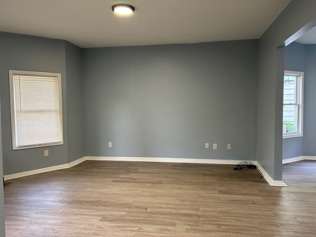 spare room featuring light hardwood / wood-style flooring