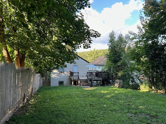 view of yard with a wooden deck