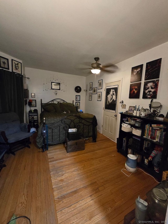 bedroom featuring hardwood / wood-style flooring and ceiling fan