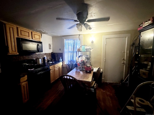 kitchen featuring ceiling fan, dark hardwood / wood-style flooring, and stove