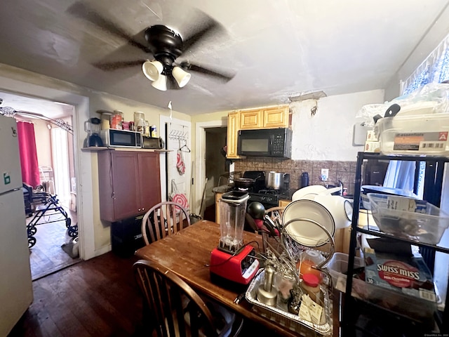 dining area featuring ceiling fan and hardwood / wood-style floors