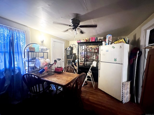 dining area featuring ceiling fan and wood-type flooring