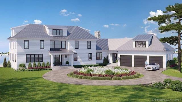 view of front of house featuring a garage and a front lawn