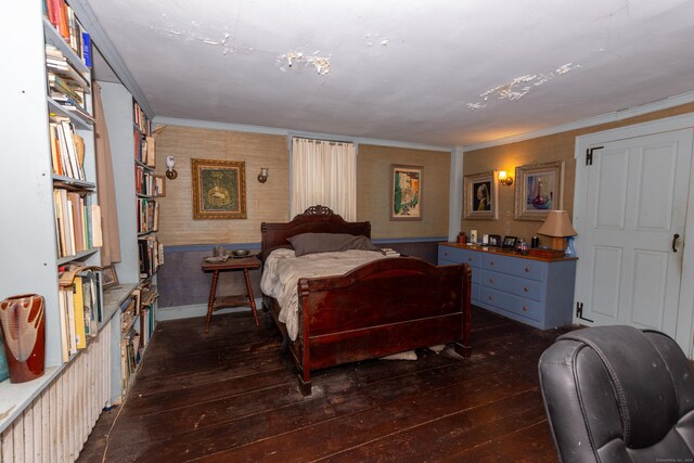 bedroom with dark wood-type flooring and crown molding