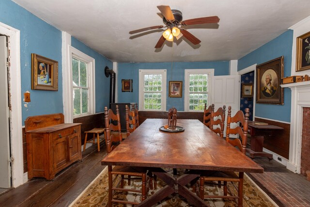 dining space featuring ceiling fan and dark wood-type flooring