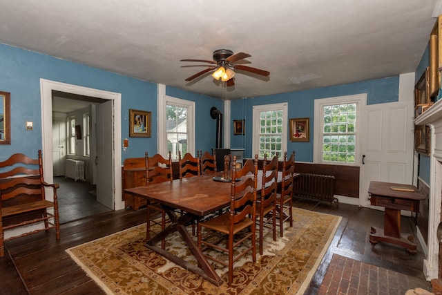 dining room with ceiling fan and radiator heating unit