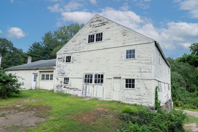 back of house with a yard