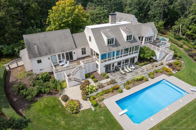 138 River Rd, Deep River, CT 06417 - back of property featuring stairway, a balcony, a chimney, a deck, and roof with shingles