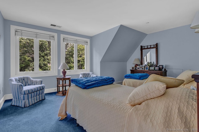 bedroom featuring vaulted ceiling and carpet flooring