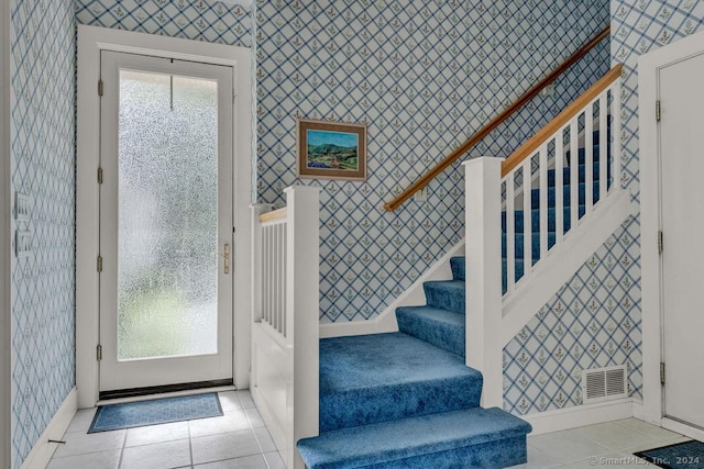 138 River Rd, Deep River, CT 06417 - entryway with wallpapered walls, stairway, baseboards, and tile patterned floors
