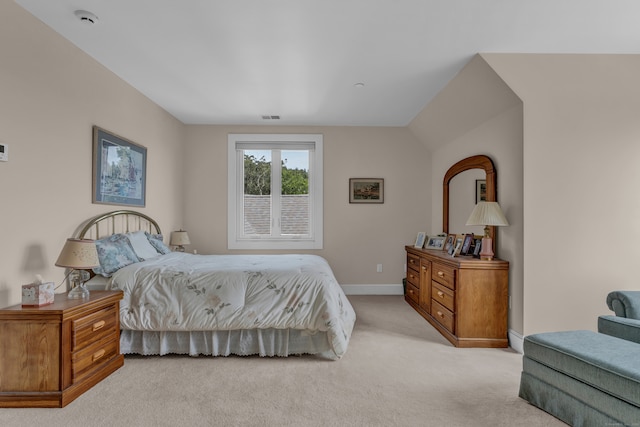 carpeted bedroom featuring vaulted ceiling