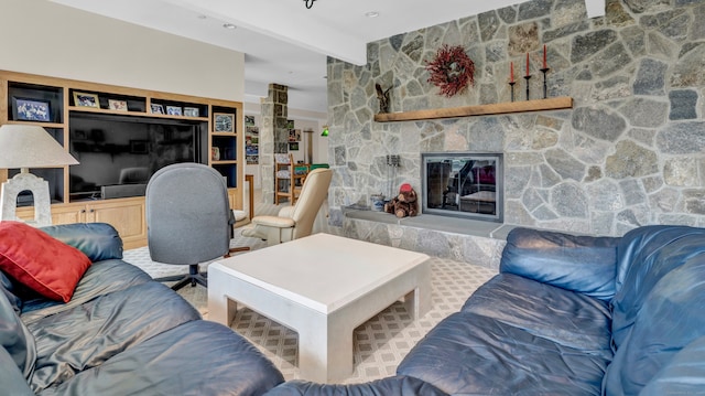 living room with beamed ceiling, a fireplace, and carpet floors