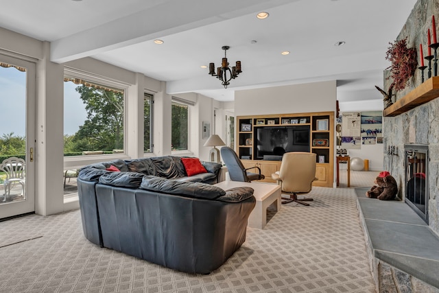 living room featuring light colored carpet, beam ceiling, a notable chandelier, and a fireplace