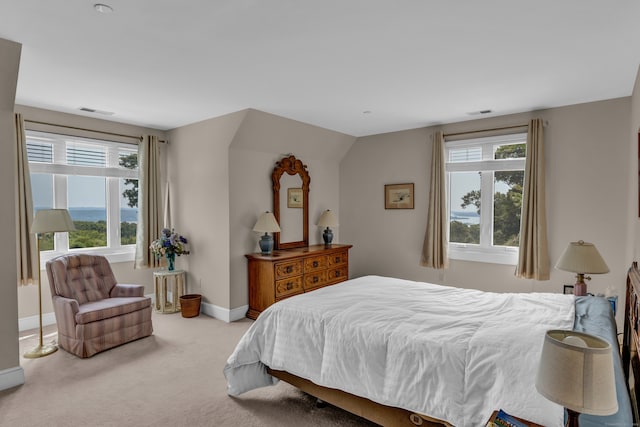 carpeted bedroom featuring vaulted ceiling