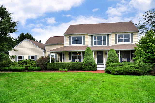 colonial-style house with a front yard