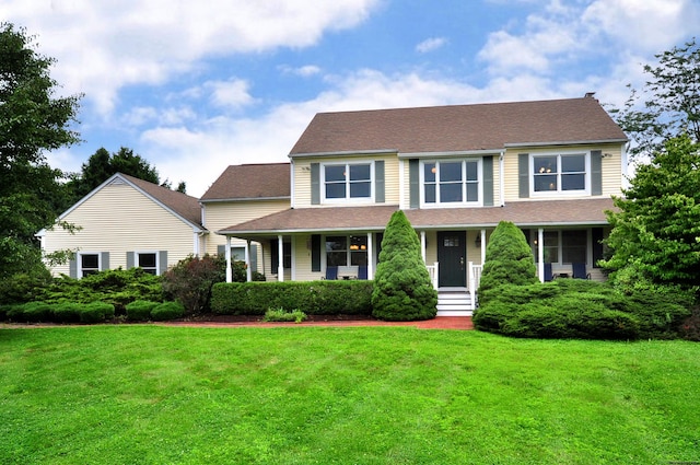 colonial home with a front lawn