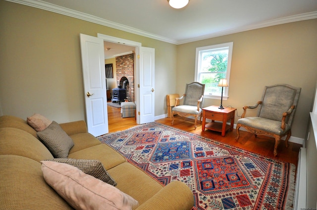 living area with crown molding, baseboards, and wood finished floors