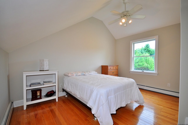 bedroom featuring a baseboard heating unit, lofted ceiling, wood-type flooring, and ceiling fan