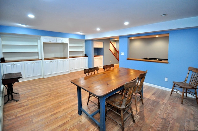 dining area featuring light wood-type flooring, stairway, baseboards, and recessed lighting