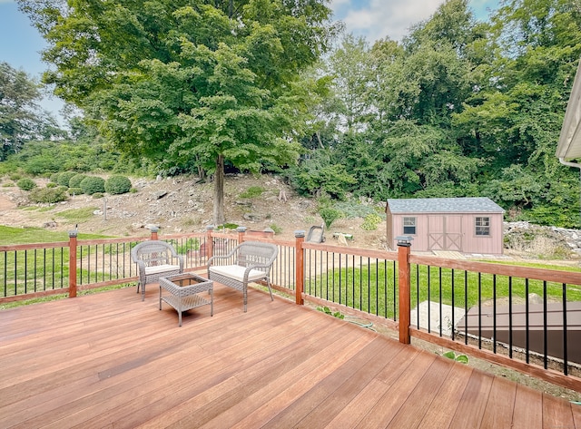 wooden terrace with a yard and a shed