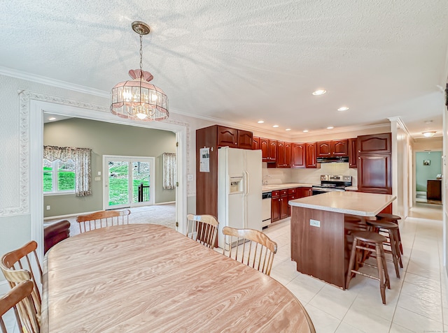 tiled dining room with a notable chandelier, crown molding, and a textured ceiling