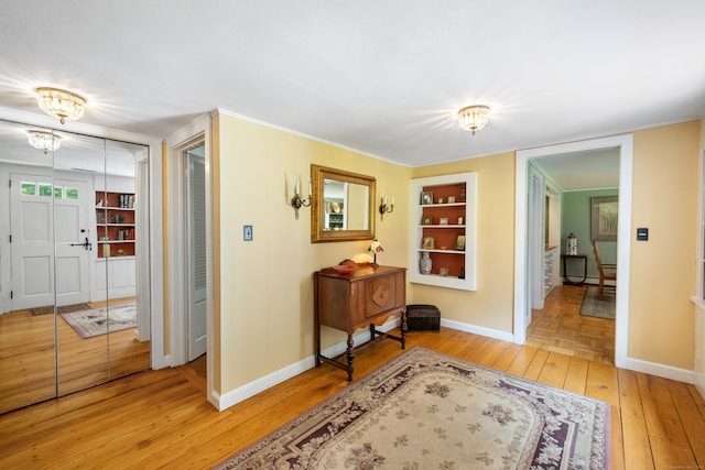 interior space featuring built in features and light hardwood / wood-style floors