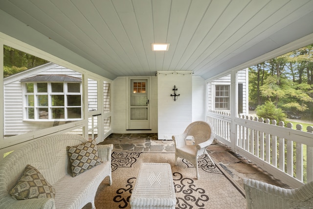 sunroom / solarium featuring wooden ceiling