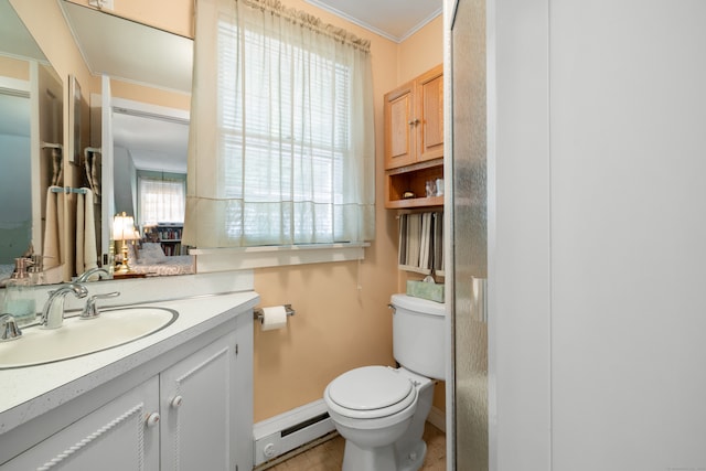 bathroom with a baseboard heating unit, vanity, toilet, and plenty of natural light