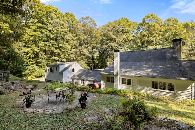 rear view of house with a patio