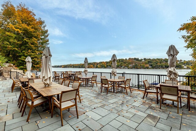 view of patio with a water view