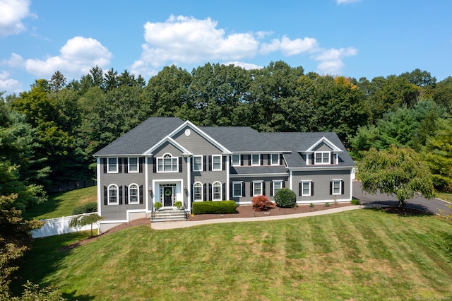 colonial-style house with a front yard