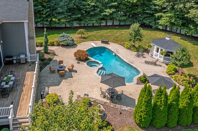 view of pool with a patio, a gazebo, and a lawn