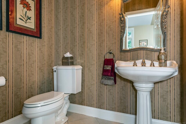 bathroom featuring tile patterned floors and toilet