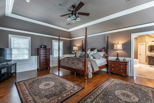 bedroom with dark wood-type flooring, ceiling fan, ornamental molding, and ensuite bathroom