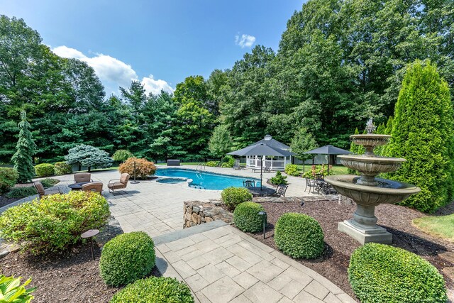 view of pool featuring a patio and a gazebo