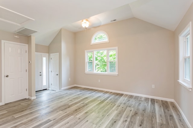 unfurnished bedroom featuring light hardwood / wood-style floors and vaulted ceiling