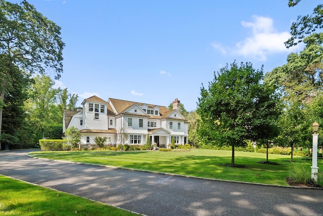 29 Sturges Commons, Westport, CT 06880 - shingle-style home featuring a front lawn and a chimney