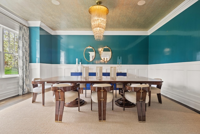 29 Sturges Commons, Westport, CT 06880 - dining space with an inviting chandelier, a decorative wall, a wainscoted wall, and crown molding