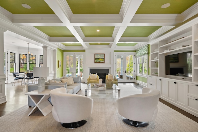 29 Sturges Commons, Westport, CT 06880 - living area featuring crown molding, beamed ceiling, french doors, and a healthy amount of sunlight